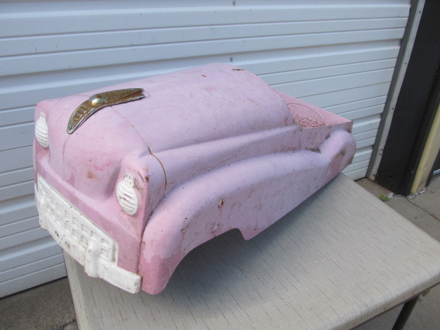 pink metal pedal car