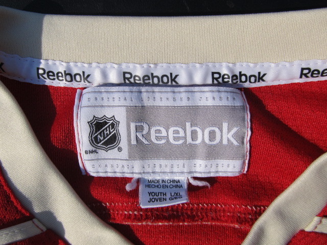 lot 100 image: Kids Wild Mikko Koivu Jersey & Hat