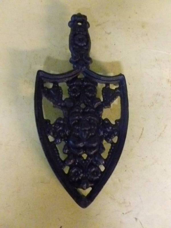 lot 102 image: Cast Iron Trivet