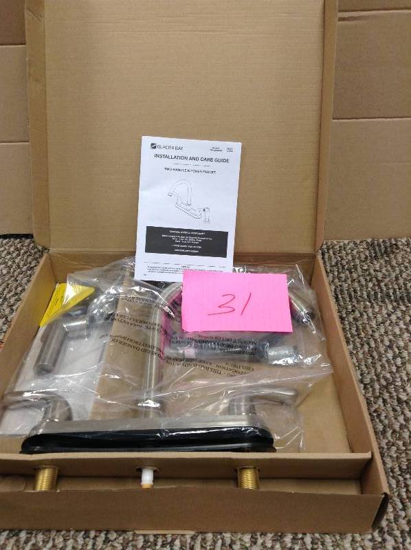 lot 31 image: Glacier Bay Builders 2-Handle Standard Kitchen Faucet with Sprayer in Stainless Steel
