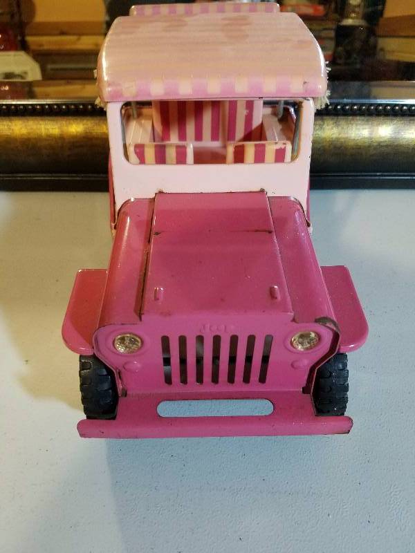 lot 38 image: Tonka...Pink Surrey Jeep...1960s