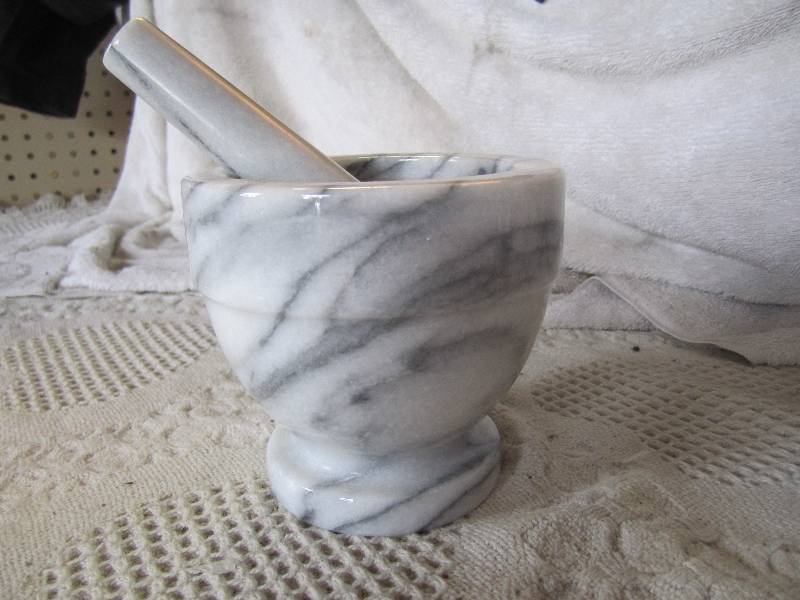 lot 53 image: Mortar and Pestle 4.5 high....