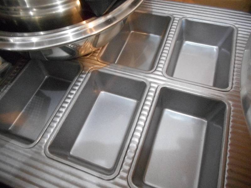 TWO BOX LOT OF ALL SORTS OF THINGS FOR THE KITCHEN...MUFFIN PANS, RICER, COFFEE CUPS...TO MUCH TO LIST