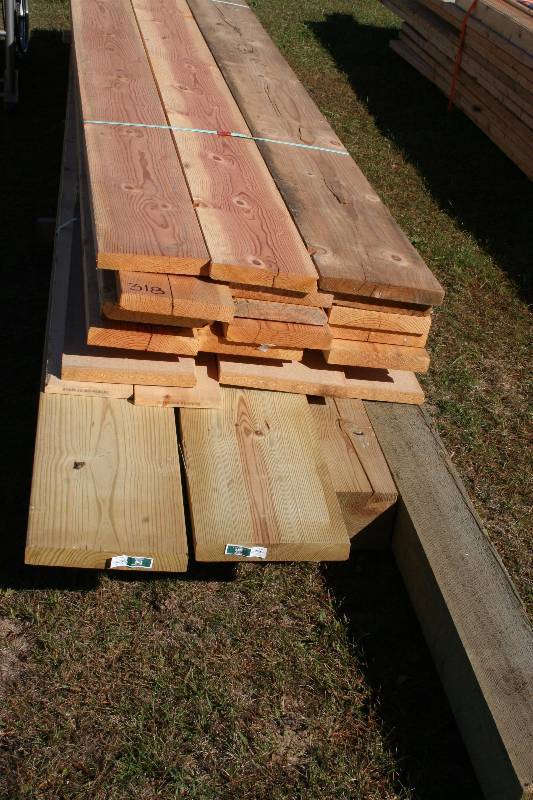 lot 55 image: Green Treated Posts, 2x12s, AND MORE