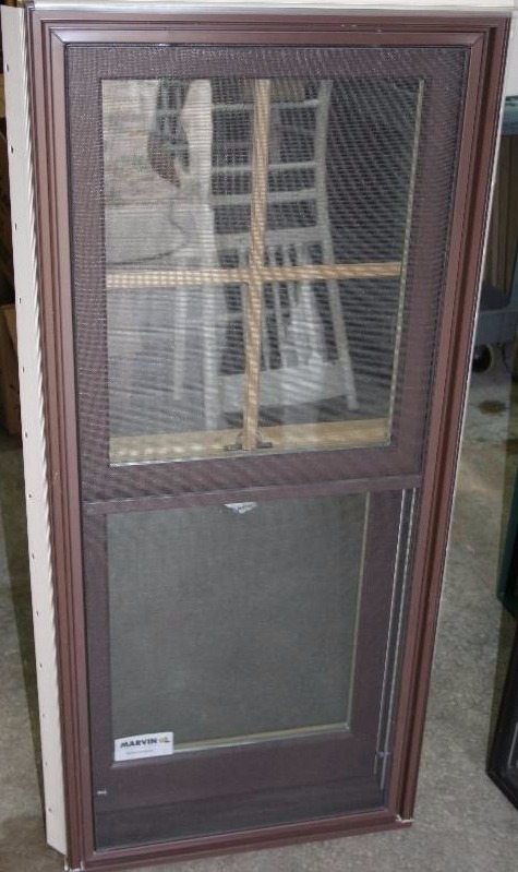 lot 604 image: Verticle Slider Window