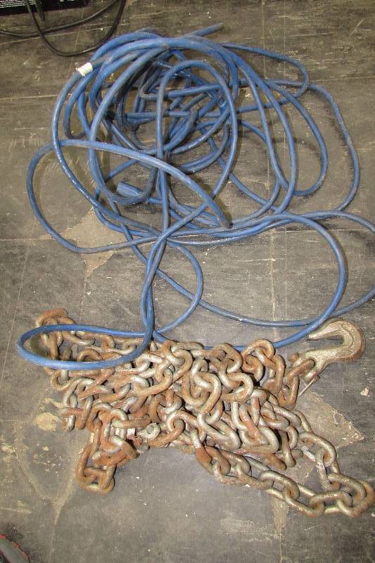 lot 555 image: EXTENSION CORD AND CHAIN  WITH HOOKS ON EACH END