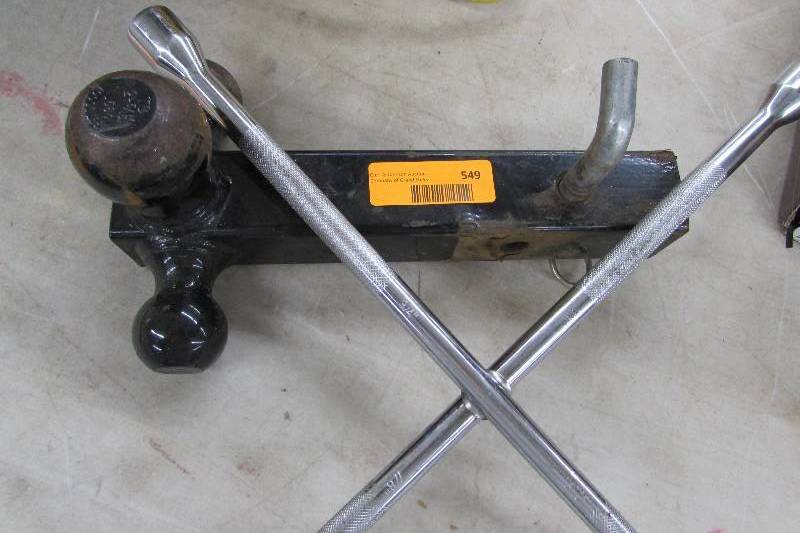 lot 549 image: THREE BALL TRUCK HITCH AND TIRE IRON