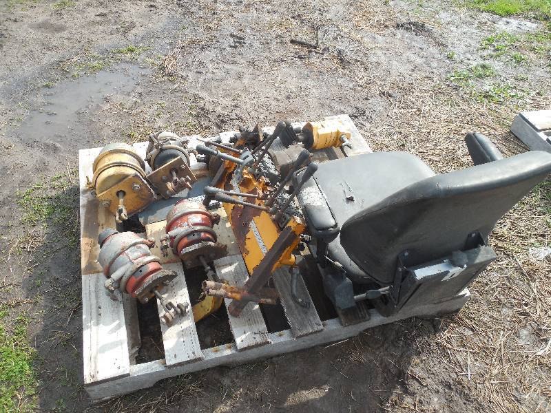lot 25 image: HYDRAULIC CONTROL BANK , MOTOR, SEAT LOT