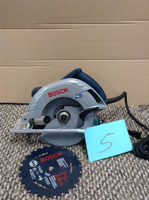 lot 5 image: Bosch 7.25-Inch 15 Amp Corded Circular Saw  not used