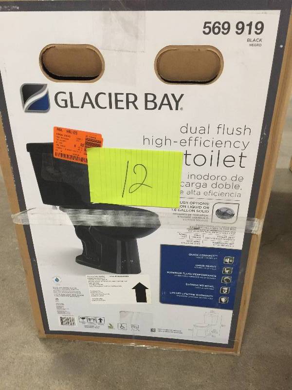 lot 12 image: Glacier Bay 2 PC 1.1 GPF1.6 High Efficiency Dual Flush Enlogated toilet in black model 569919 not used
