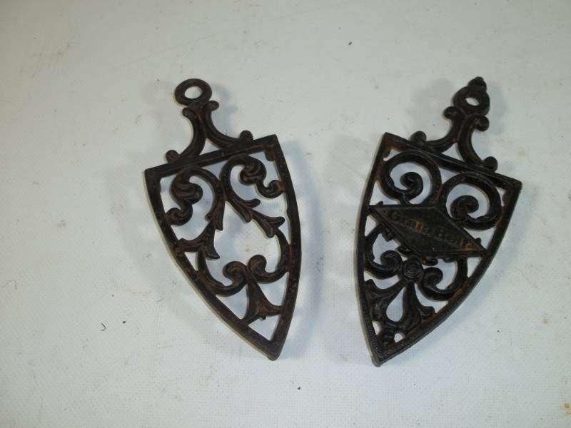 lot 128 image: Vintage iron hot plates one is Grain Belt