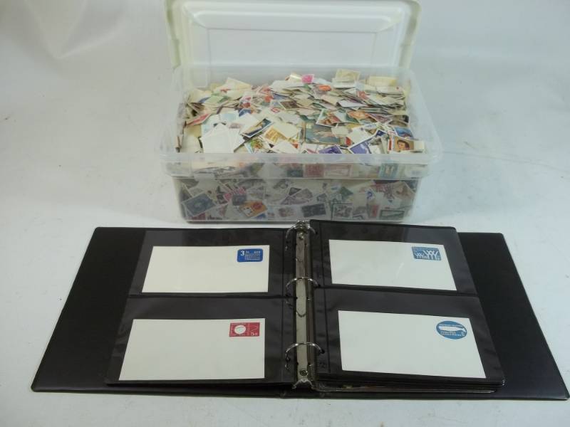 lot 251 image: Stamps in Binder with 12 Quart Tote of Stamps