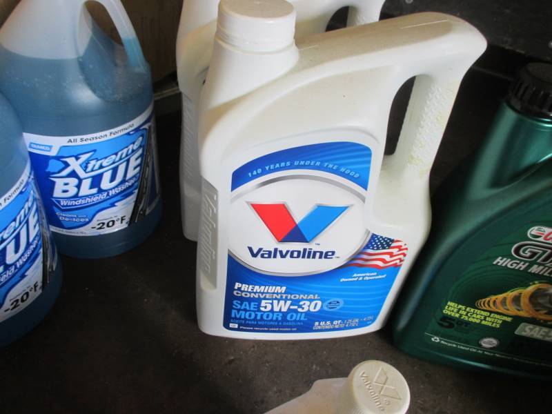 lot 102 image: Full Oil, RV Antifreeze, Washer Fluid