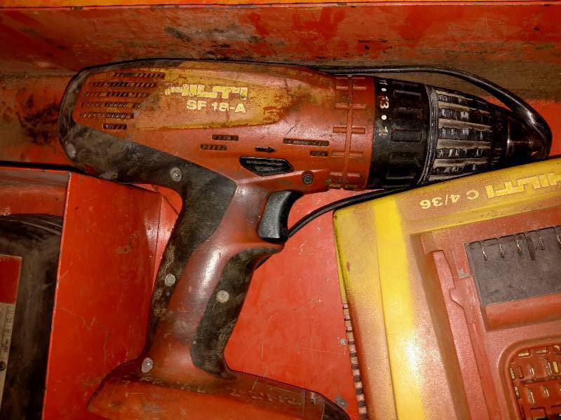 lot 105 image: HILTI Cordless Drill, Battery and Charger.. Tested and works