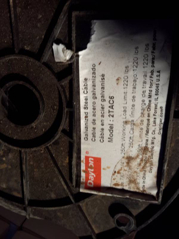lot 269 image: Roll of 250 ft, 1220 lb Galvanized Steel Cable.. New