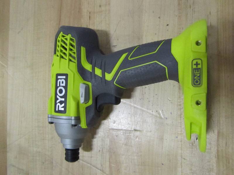 lot 61 image: Ryobi Drill (p235) with charger.
