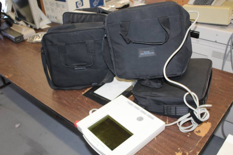 lot 66 image: Lot of (4) Computer Hardware Includes Texas Instruments TI ViewScreen, Accessories, Bags