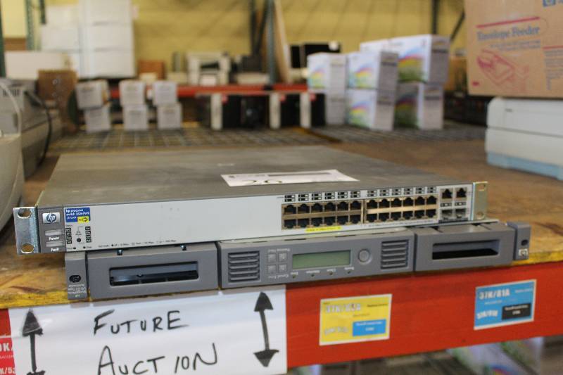 lot 26 image: Lot of (2) HP Rack-Mount Computer Hardware Includes 1) Procurve Switch 2626-PWR Model J8164A AND 1) StorageWorks 18 G2 Tape AutoLoader