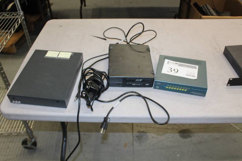 lot 39 image: Lot of (3) Computer Hardware Includes Cisco ASA 5505 Adaptive Security Appliance AND 1) HP StorageWorks DAT72 USB Digital Data Storage Tape Drive AND 1) Cisco Model PIX Series