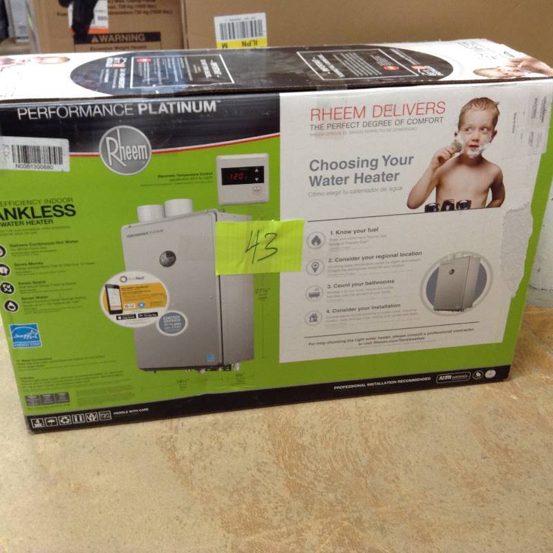 lot 43 image: MSRP $1299 Never used Rheem 9.5 GPM Natural Gas High Efficiency Indoor Tankless Water Heater
