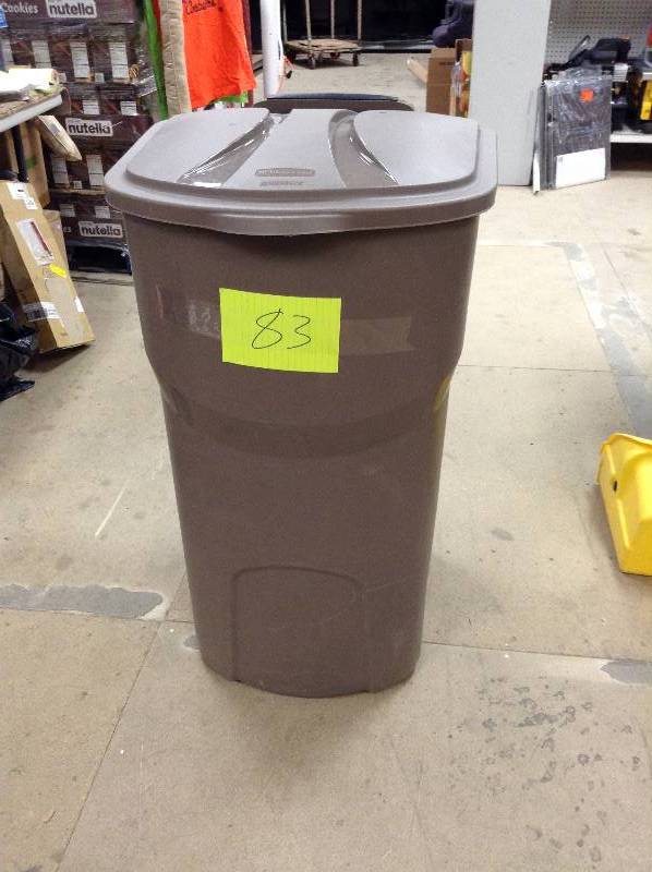 lot 83 image: never used Rubbermaid Roughneck 45 Gal. Black Wheeled Trash Can with Lid