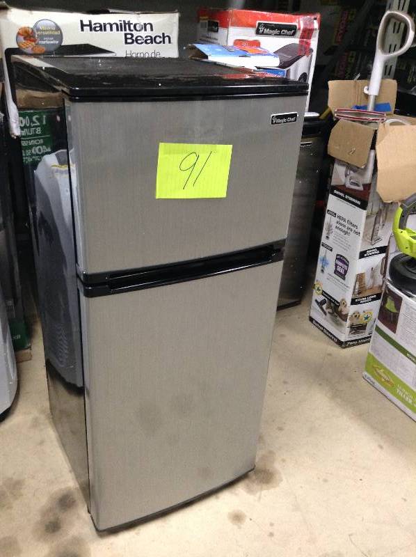 lot 91 image: MSRP $199 never used Magic Chef 4.3 cu. ft. Mini Refrigerator in Stainless Look