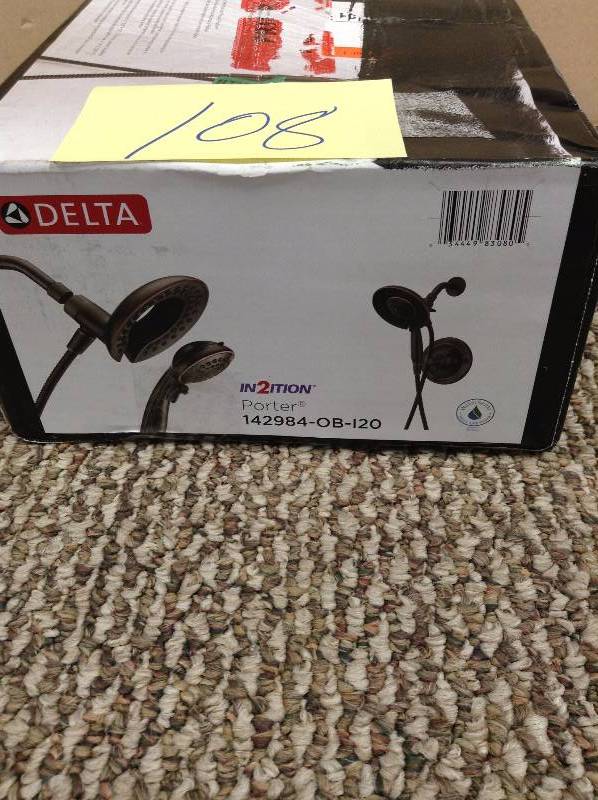 lot 108 image: Delta Porter In2ition Two-In-One Single-Handle 4-Spray Shower Faucet in Oil Rubbed Bronze MSRP $209 never used