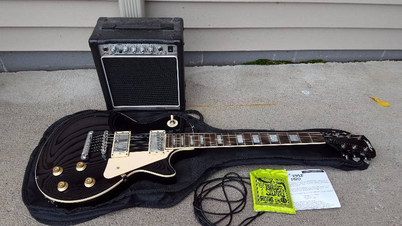 lot 3 image: Pyle Pro Guitar & GA-15 Amplifier