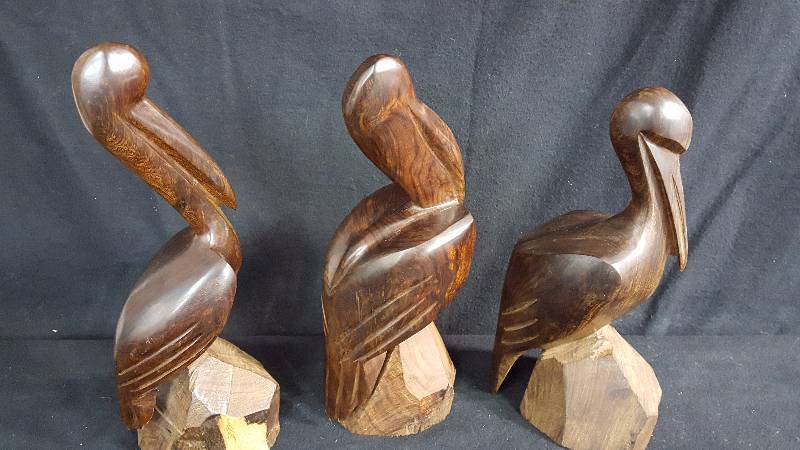 lot 140 image: Carves Ironwood Pelicans