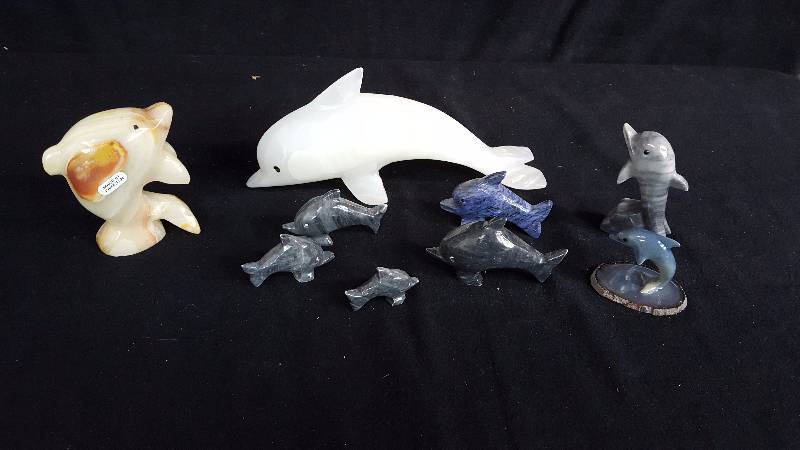 lot 154 image: Carved Stone Dolphins