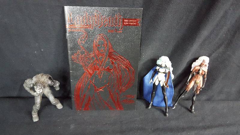 lot 177 image: Lady Death Comic Book & Figures