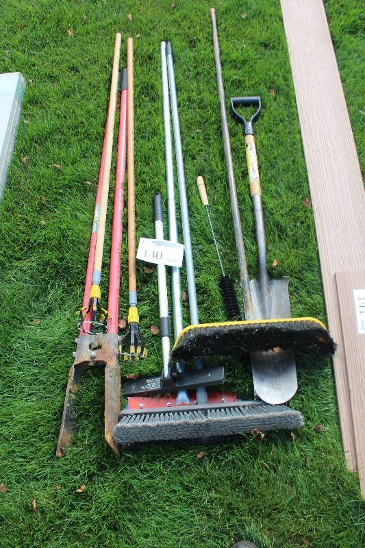 lot 140 image: Lot of (8) Hand Yard Tools Includes Brooms, Pole Diggers, Spades, Bulb Changer, And More