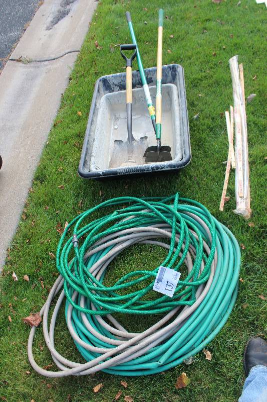 lot 137 image: Lot of Yard Tools Includes 2-Plastic Bins, 2-Garden Hoses, 3- Shovel,Hoes