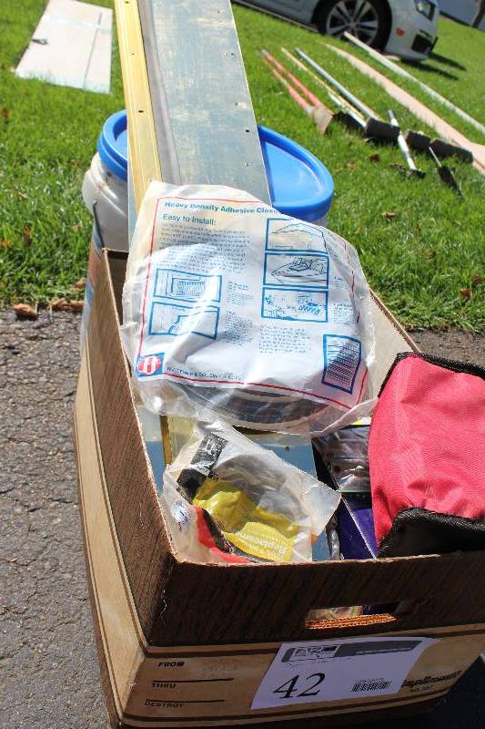 lot 42 image: Box Lot of Door Repair Supplies Includes Foam Tape, Rubber Door Guard, Front Door Handle, Knobs, Hardware