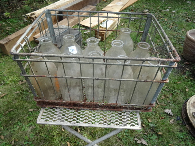 lot 150 image: Vintage Milk Bottle In Metal Milk Crate.