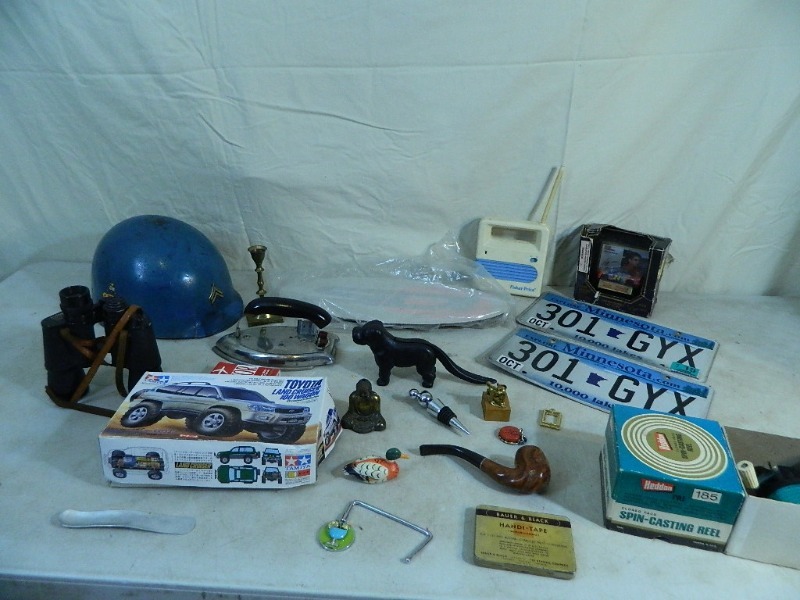 lot 28 image: Cast Dog Nut Cracker, Helmet, and More