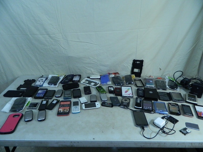 lot 30 image: Huge Assortment of Phones, Digital Camera, and Cases