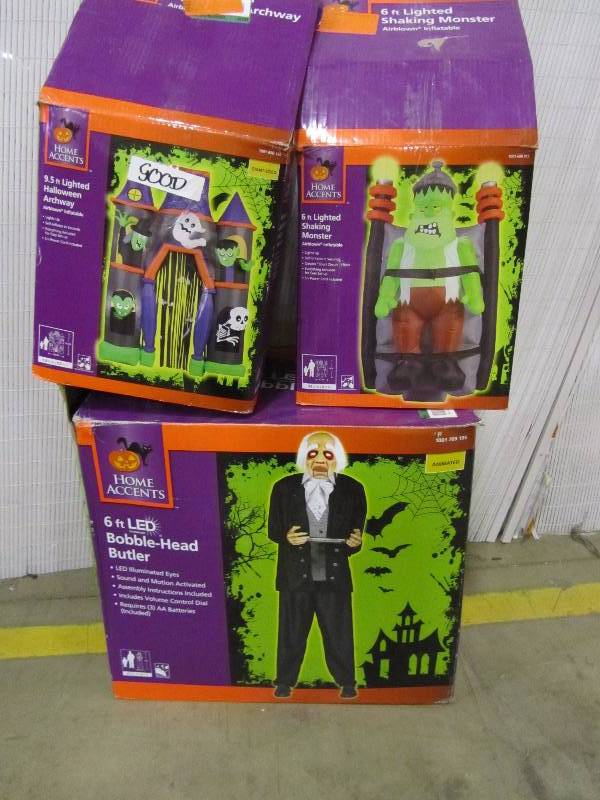 lot 7 image: 72 Standing Butler, 6 Short Circuit Monster, 81.89 x 31.50 x 114.17 Inflatable Archway Haunted House