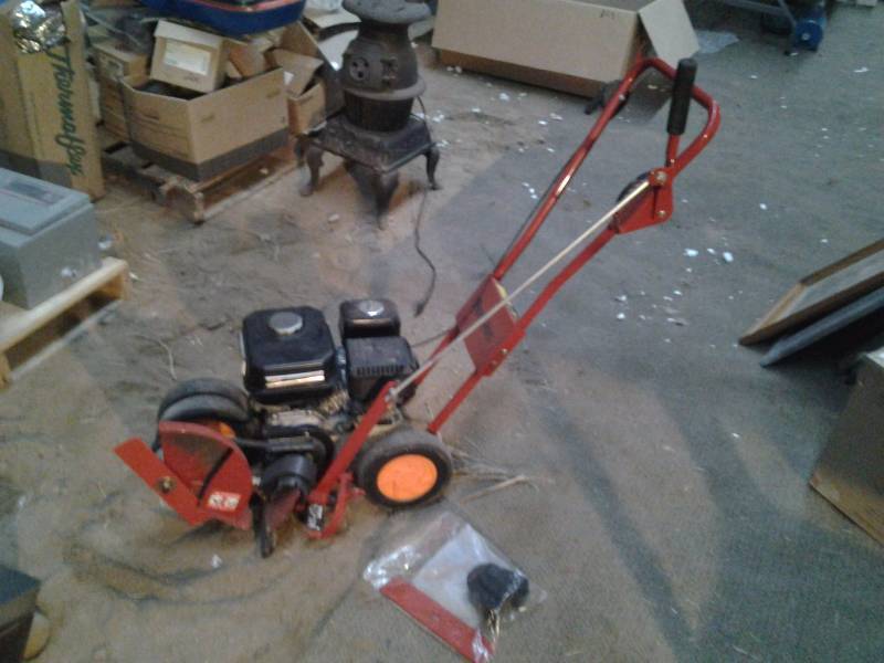 lot 47 image: Redline 4 HP Edger With Manual