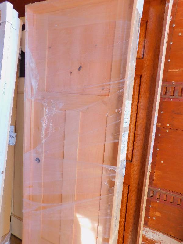 lot 56 image: New Knotty Alder 3-Panel Door with Frame