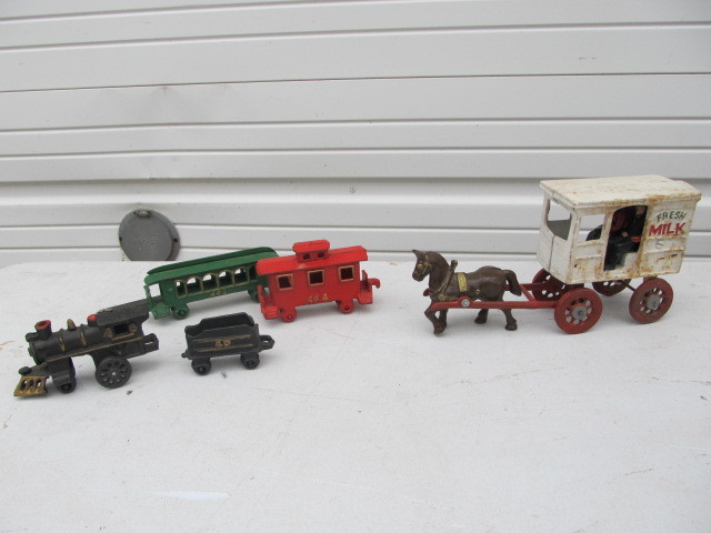lot 46 image: Cast Iron Trains & Milk Wagon