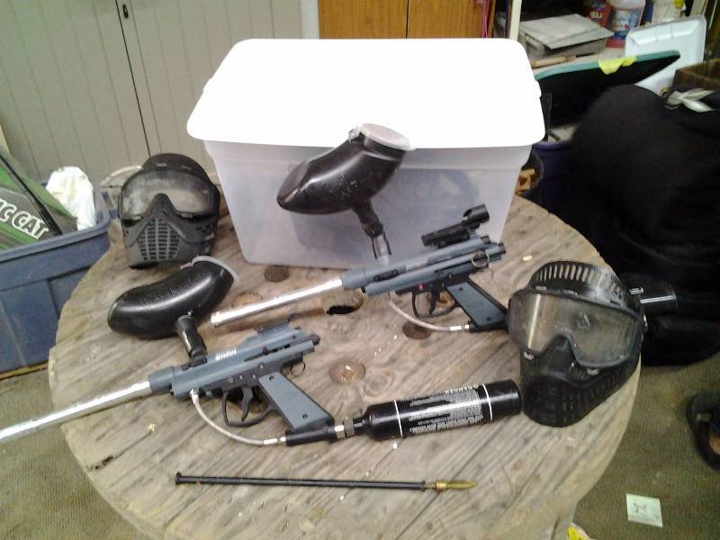 2-Paintball Guns, 2-Hoppers, 2-Masks, 2-CO2 Tanks In Tote With Lid