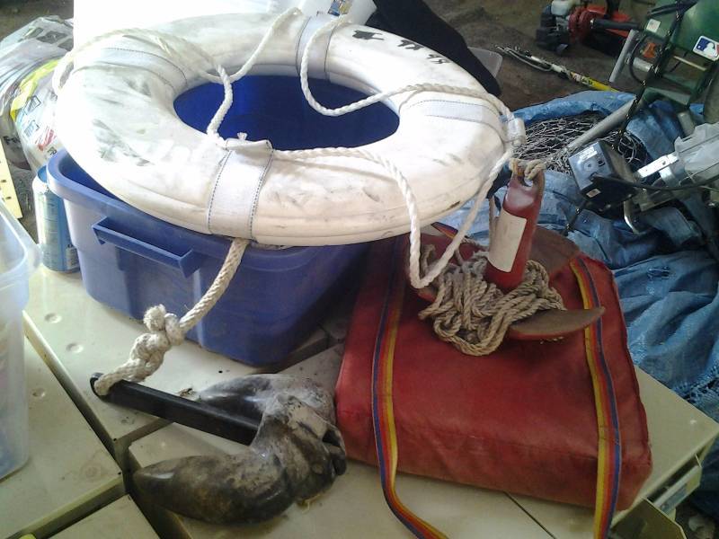lot 22 image: 2-Boat Anchors, Seat Cushion, Ring Buoy Tote With Lid