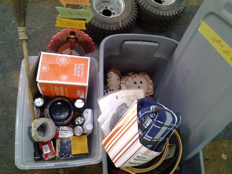 lot 25 image: 2-Totes With Lids Full Of Seasonal Fall Decor, Scarecrows, Fog Machine, Fog Fuel, Lights, Crafts