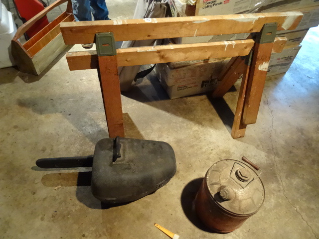 lot 94 image: Saw Horses, Gas Can, Chain Saw Case Empty