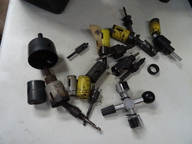 Bin of misc hole saws. Battery terminal cleaner