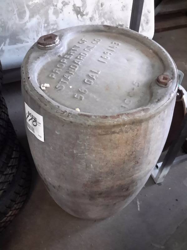 lot 110 image: 56 gal stnd. Oil metal barrel as pictured