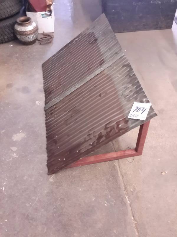 lot 104 image: a corugated sheet metal awning