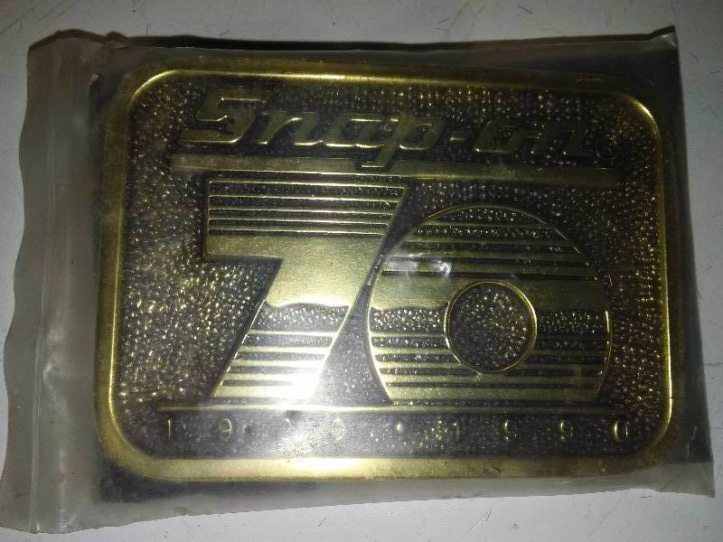 lot 52 image: Snap-on 70 Yr. Anniversary belt buckle 1920-1980