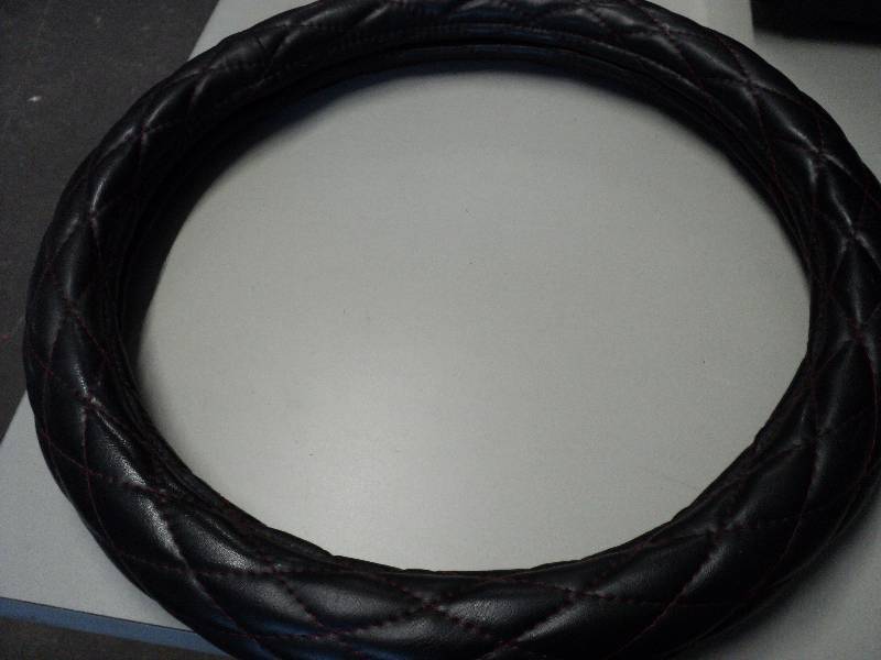 lot 319 image: steering wheel cover...